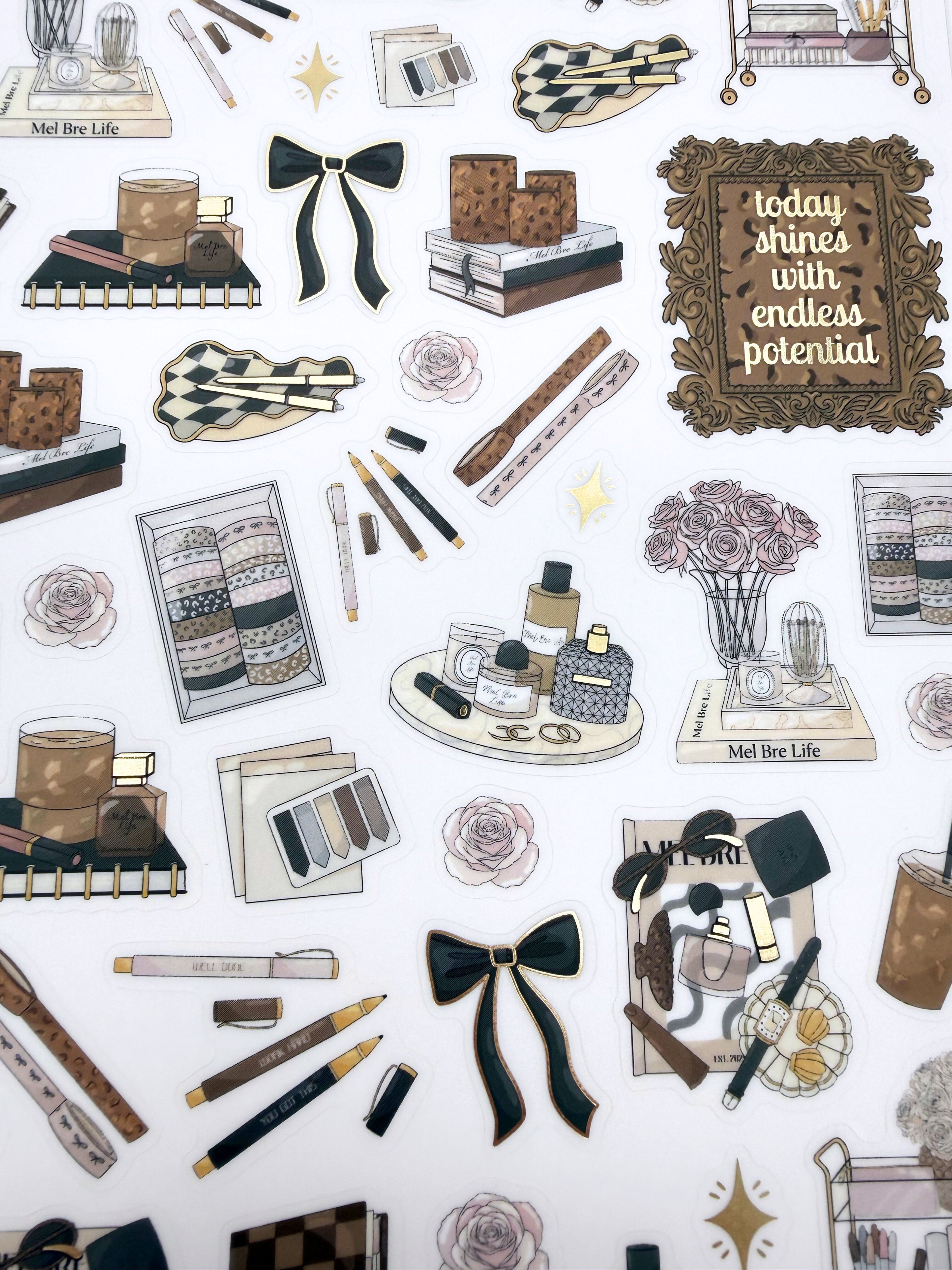 Clear matte glam planner sticker sheet with gold foil accents featuring lifestyle icons, home décor, beauty details, florals, and planning supplies