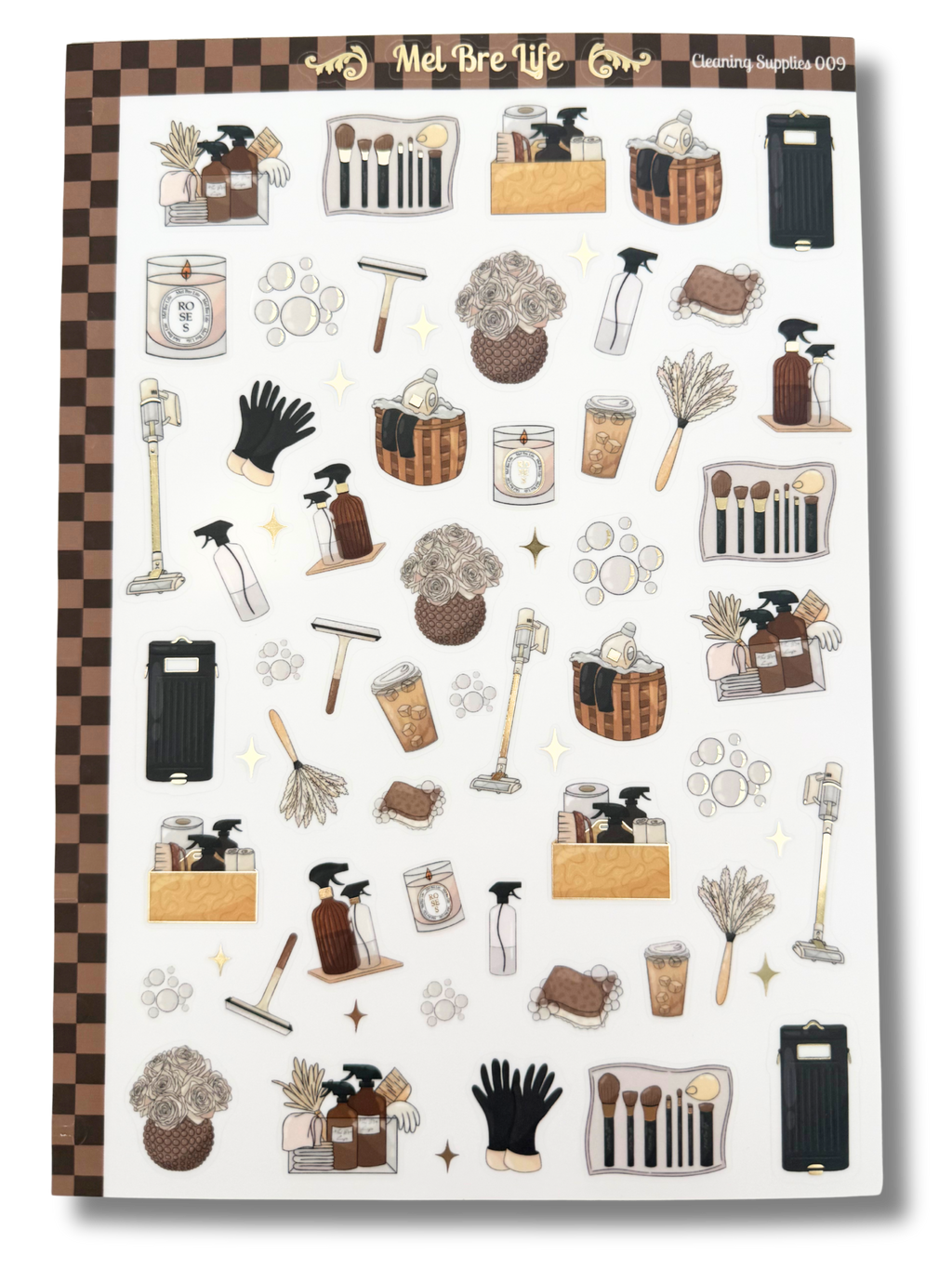 Clear matte glam planner sticker sheet with gold foil accents featuring cleaning supplies, baskets, sprays, and cozy home reset icons