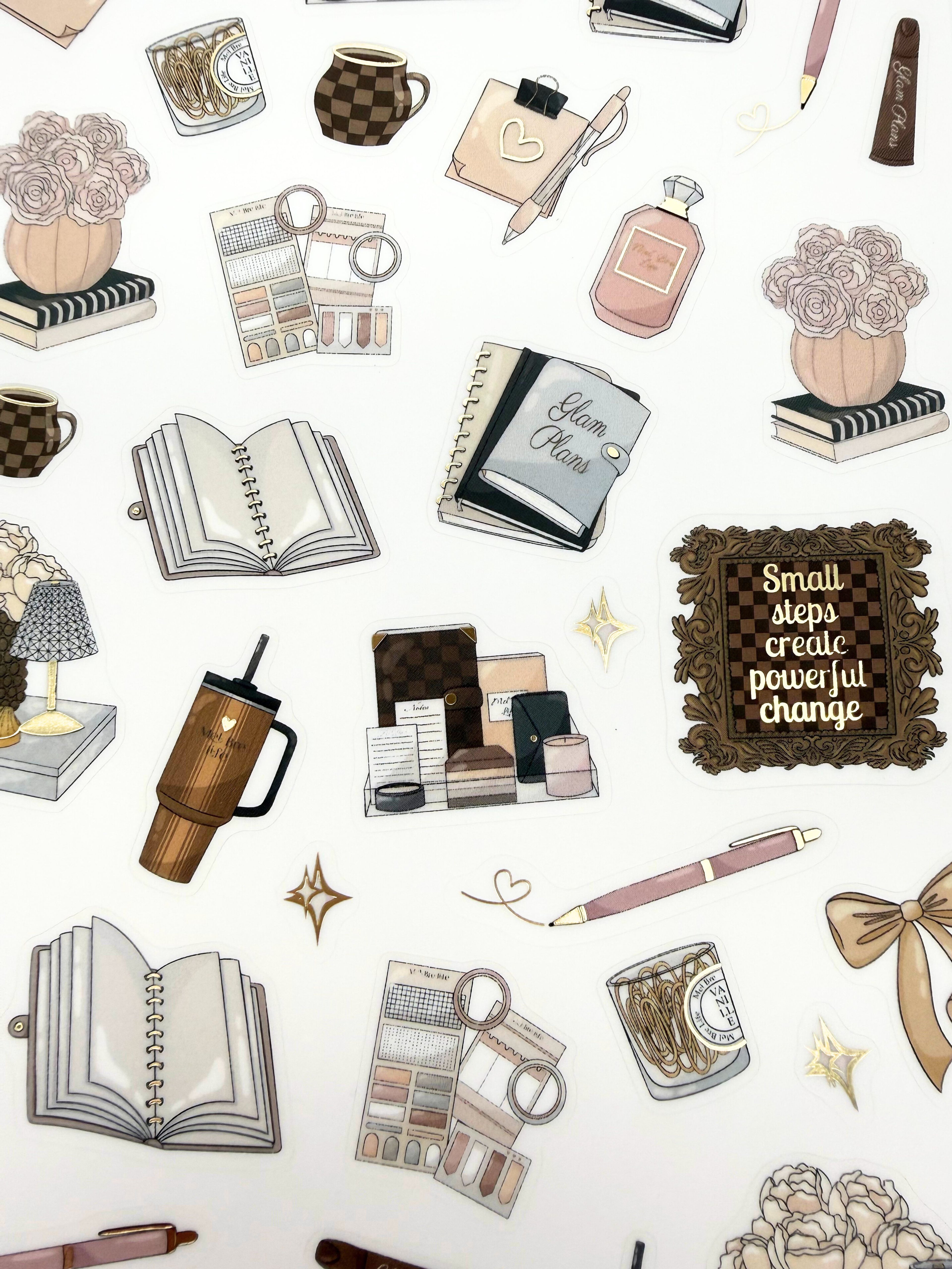 Clear matte glam planner sticker sheet with gold foil accents featuring books, mugs, bows, florals, and inspirational quotes