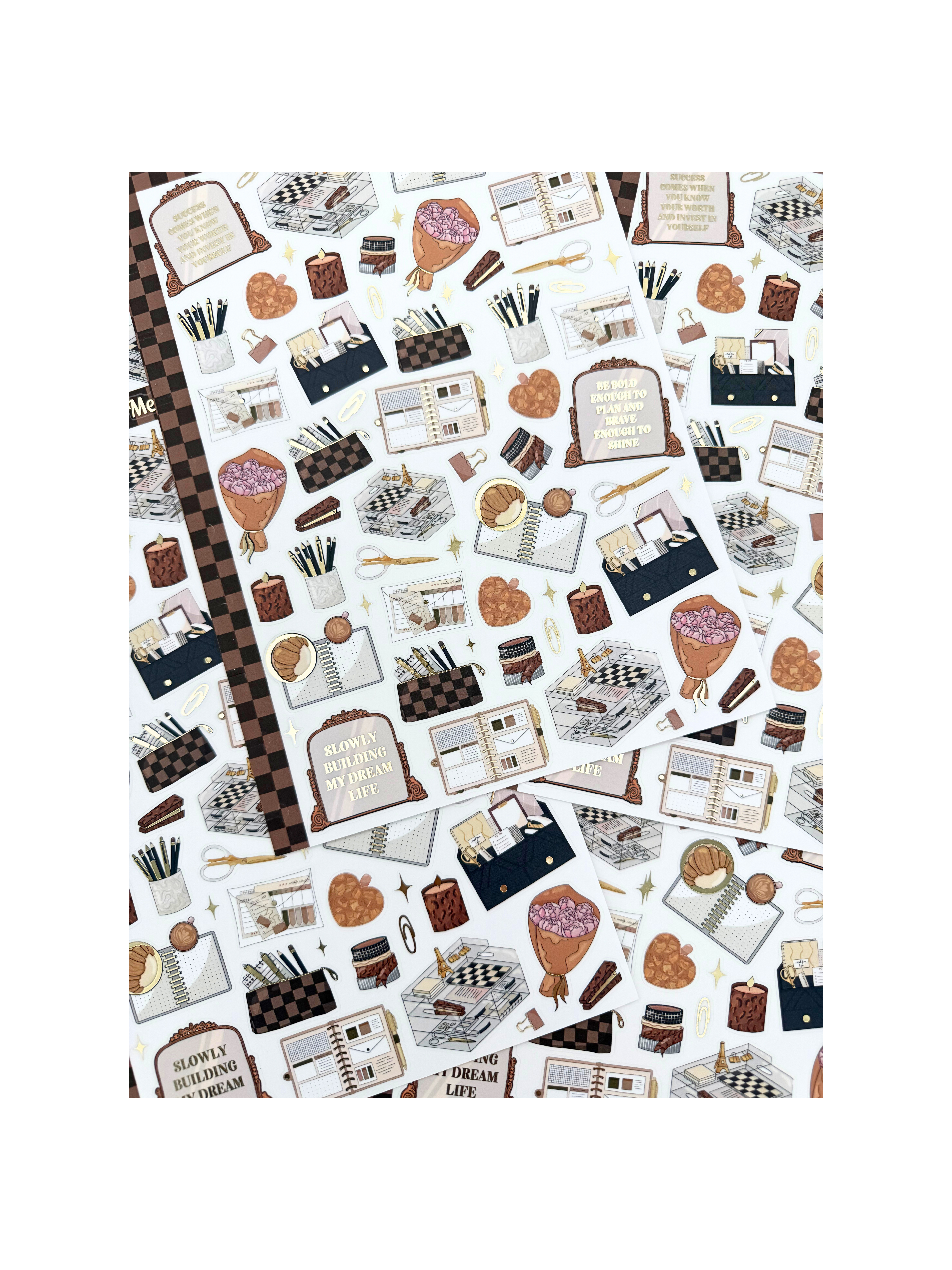 Clear matte glam planner sticker sheet with gold foil accents featuring planners, notebooks, candles, florals, and motivational quotes