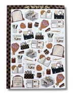 Clear matte glam planner sticker sheet with gold foil accents featuring planners, notebooks, candles, florals, and motivational quotes