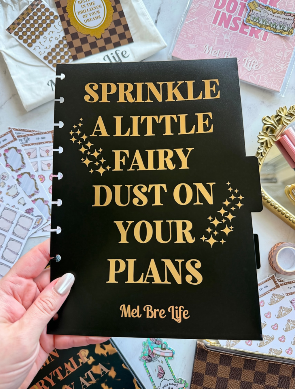 Fairytale Plans black planner divider with gold “Sprinkle a Little Fairy Dust on Your Plans” quote and fairy-inspired details