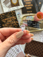 Close-up of a Princess Confetti fairytale sticker featuring a bouquet of pink flowers
